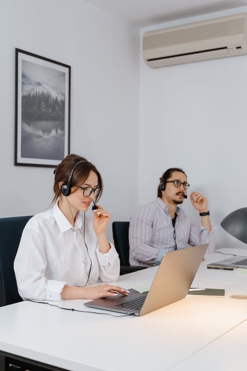 Two people working in an office